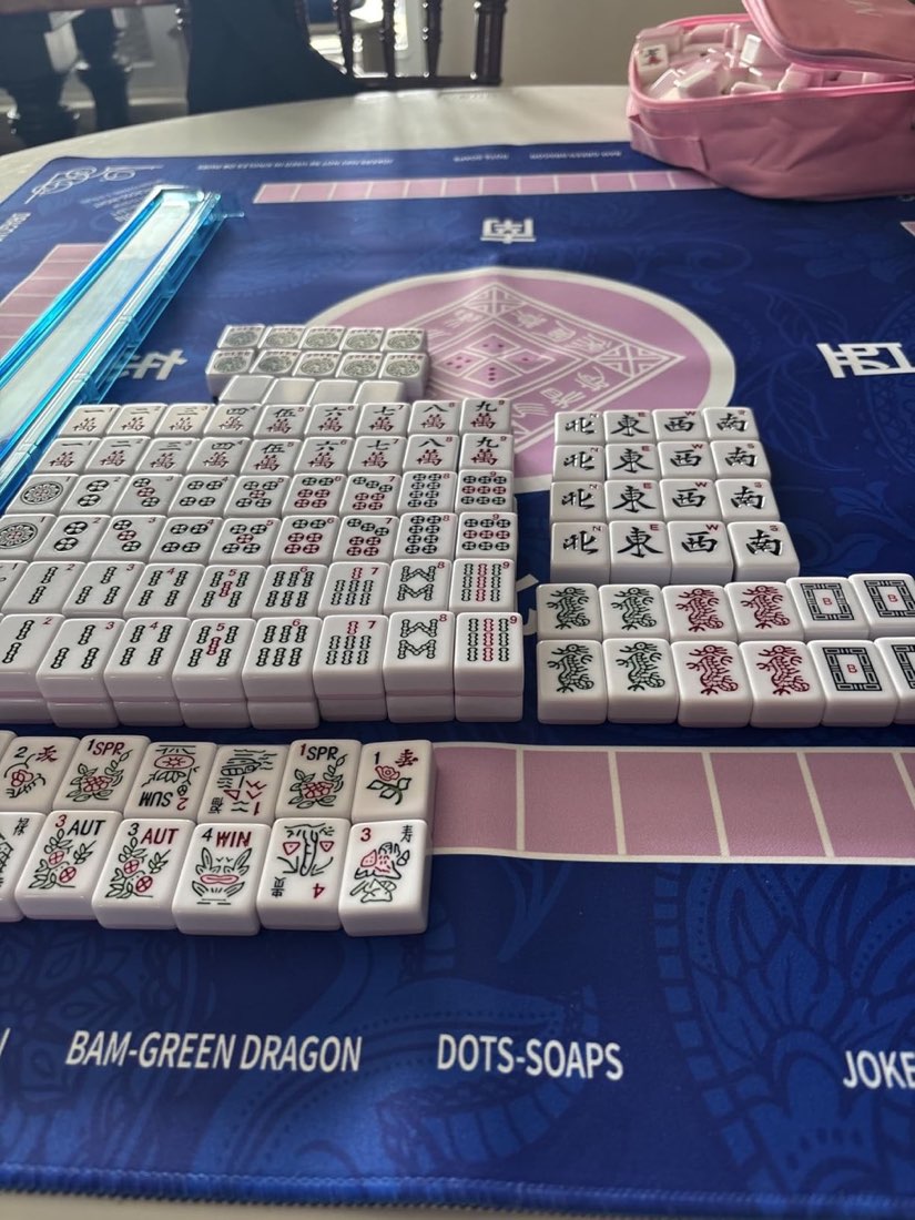 A full American Mahjong tile set sorted on a blue 2F22E mat