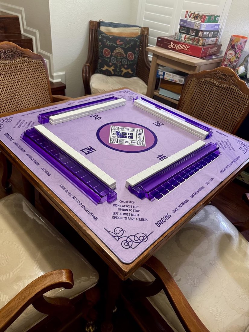 Purple 2F22E mat on a wooden card table with walls built and four racks